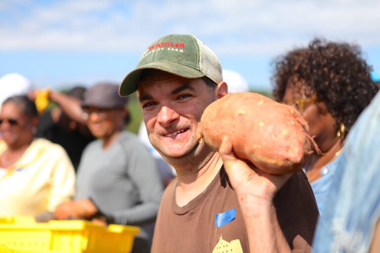 Paul holding a big sweet potato 768x512