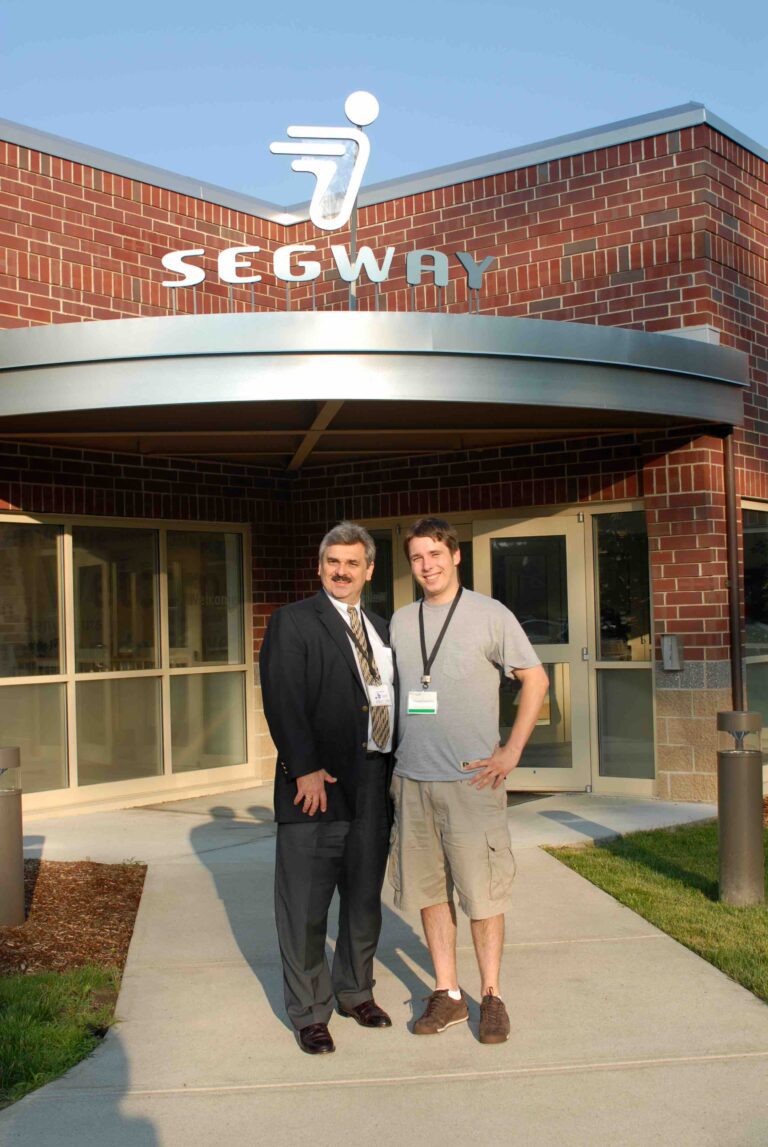 Tadek and Conrad Osipowicz in front of Segway factory in Bedford USA small 768x1147